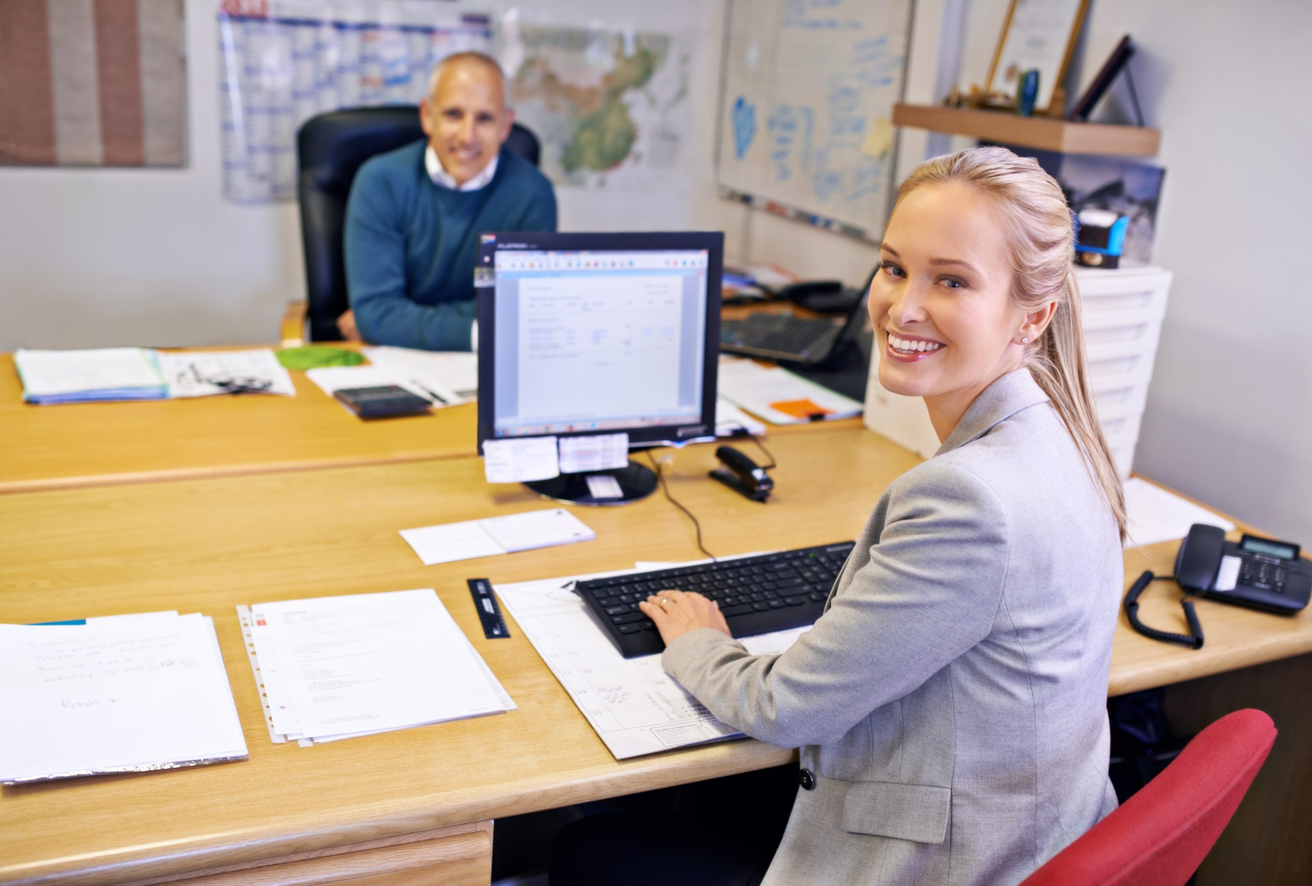 Woman and man in an office working on launching their business
